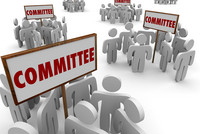 Graphic of groups of stick-figures holding signs that say Committee. 
