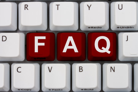 Computer keyboard with the letters F A and Q highlighted in red.